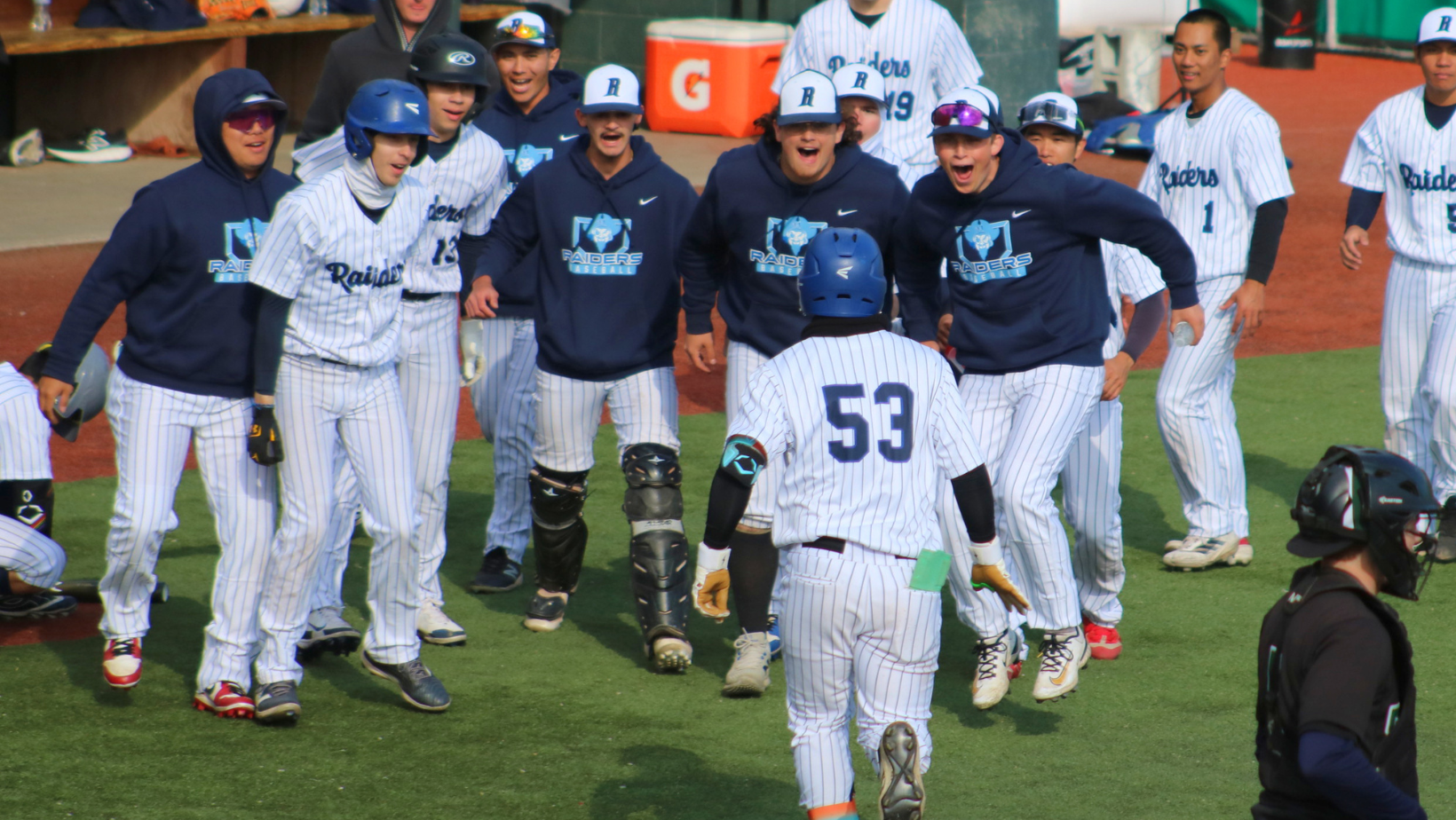 The Team Celebrates with Kao Huai En after his Home Run in Game 2.